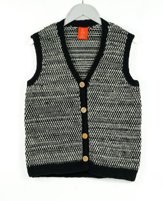 Black and White patterned cardigan with a white background