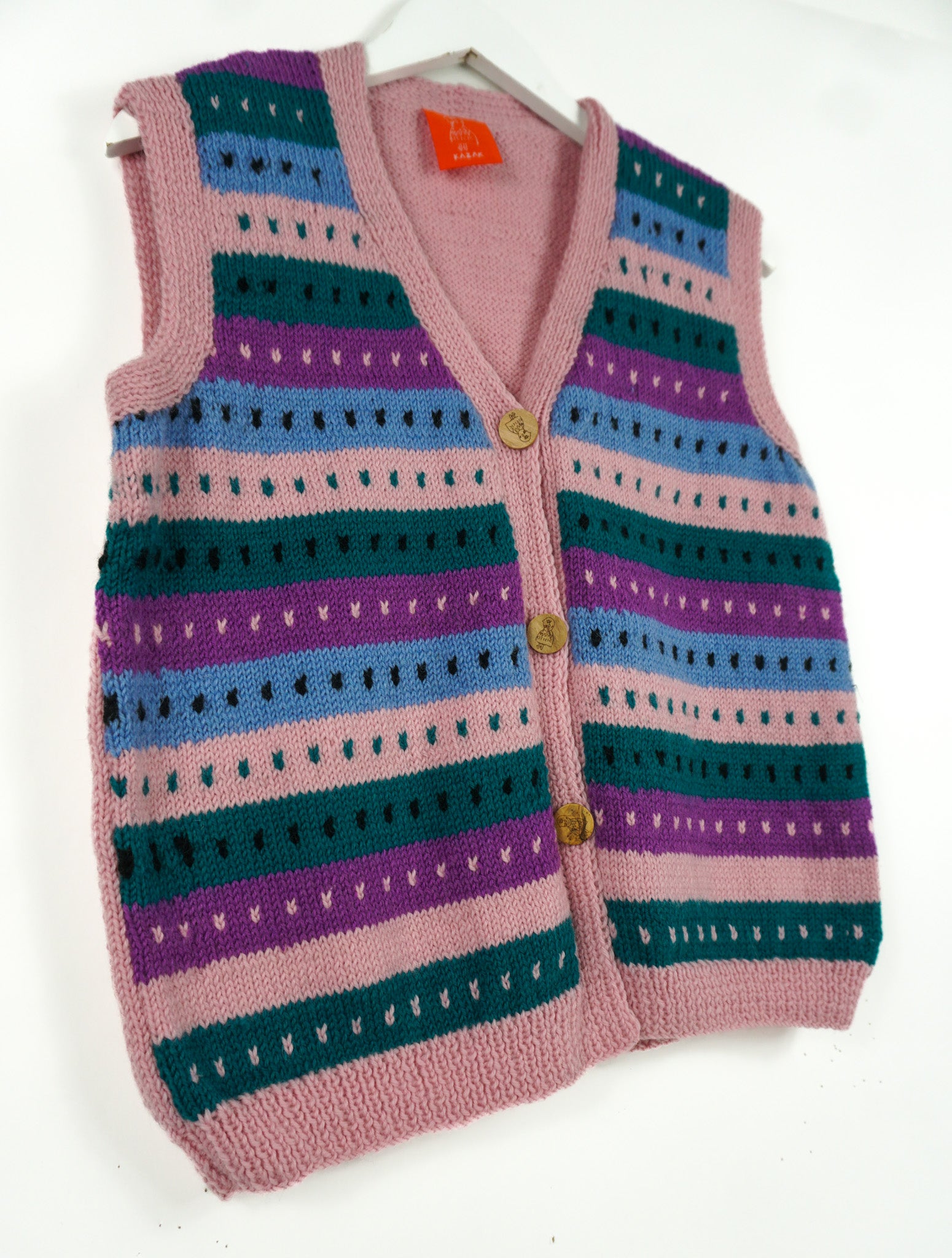 Colorful striped knitted vest on a white background