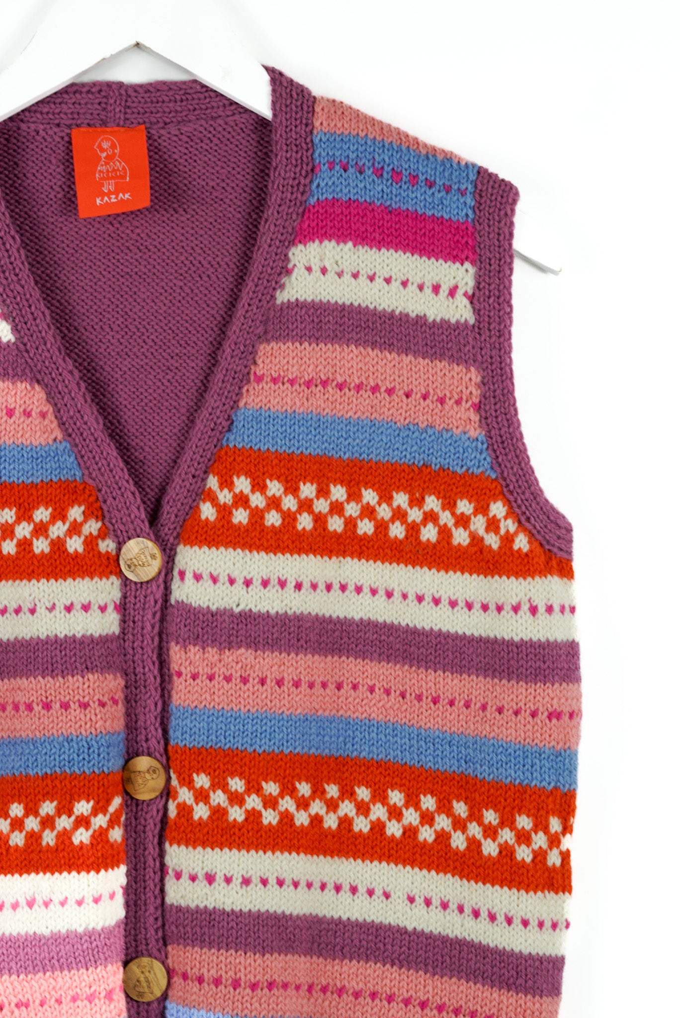 Colorful striped vest with a pattern on a white background