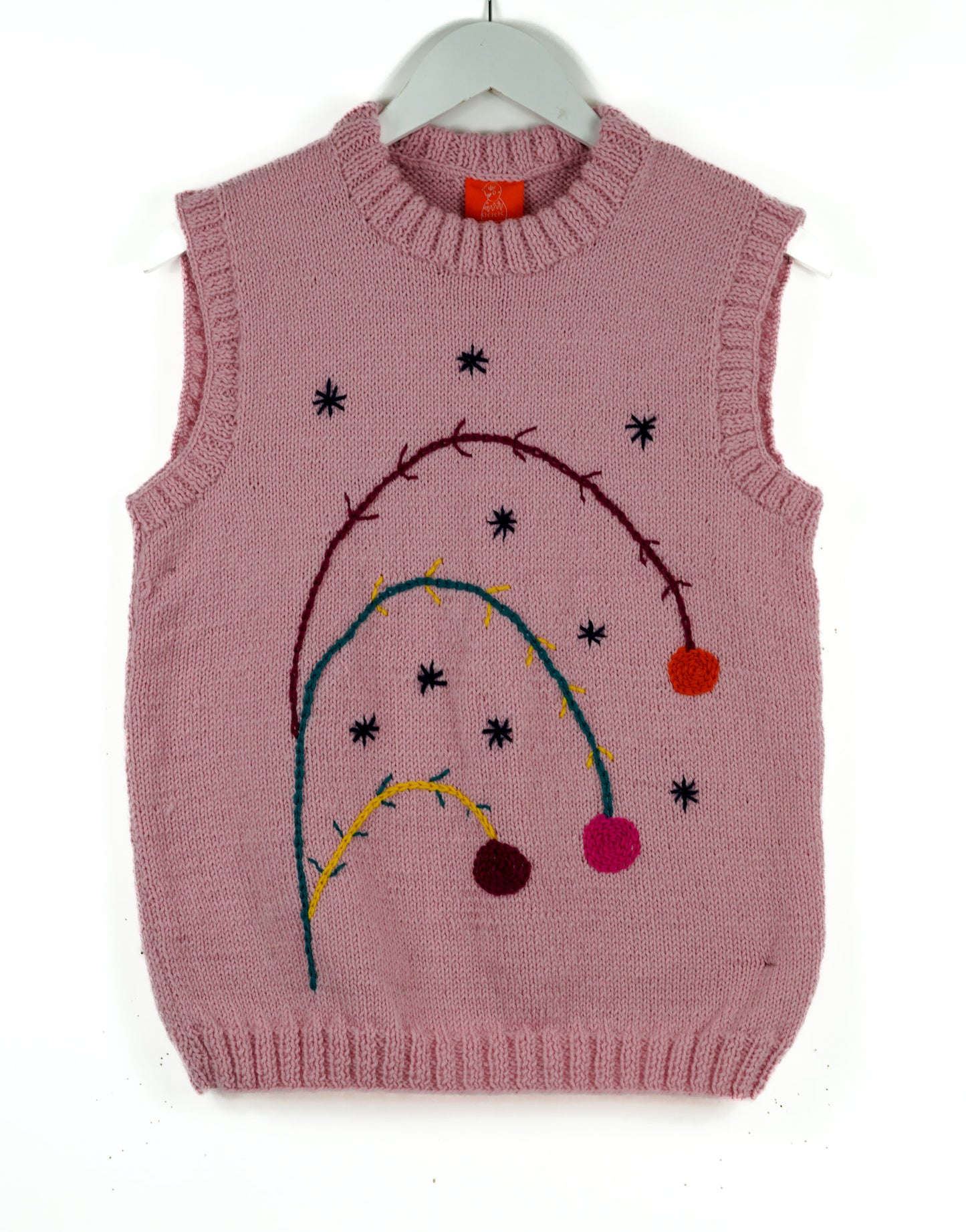 Pink pure wool vest with floral dressing on it, this is a hand knitted one off vest, tank top