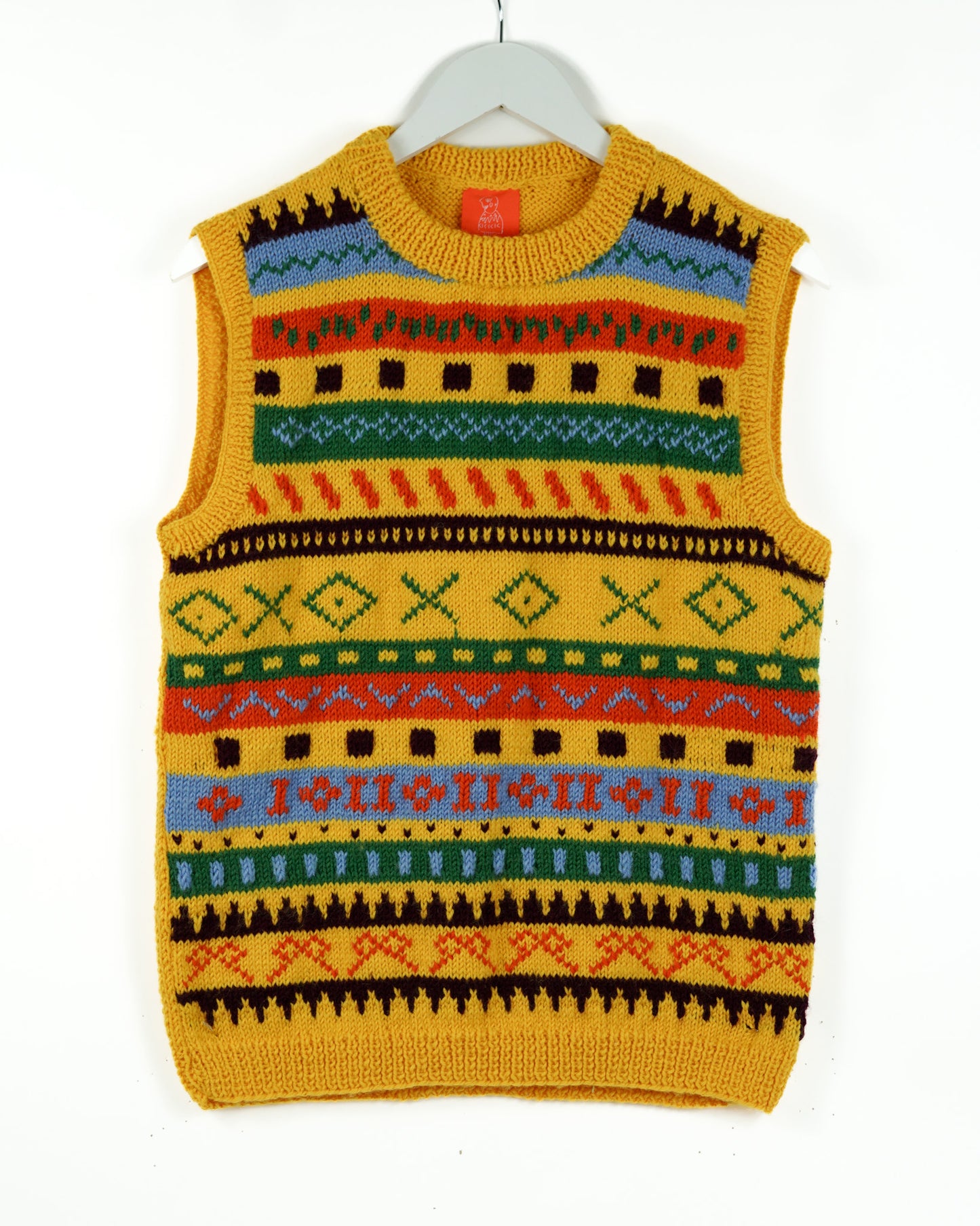 Yellow vest with heritage patterns on a white back ground