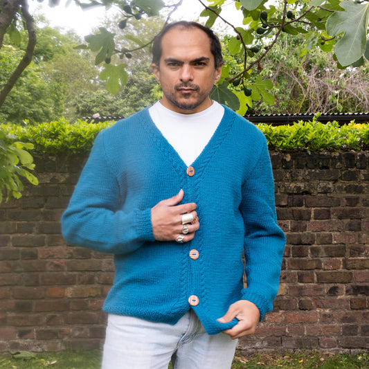 Blue hand knitted cardigan with skateboard recycled hand made buttons on a model, one off cardigan from a London brand