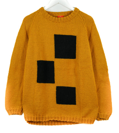 Yellow sweater with black square pattern on a white background