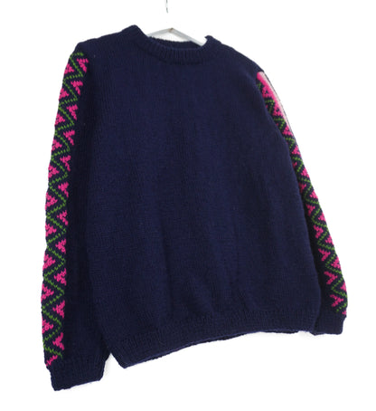 Navy Blue jumper with heritage patterns on its sleeves 