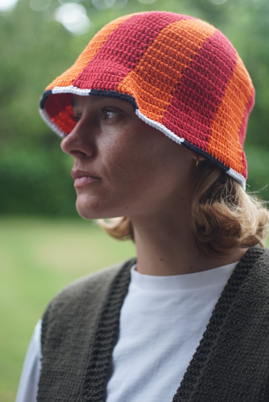 Hand Crochet cotton hat orange red duotone and worn by a model, Glastonbury fashion, one off cotton hat