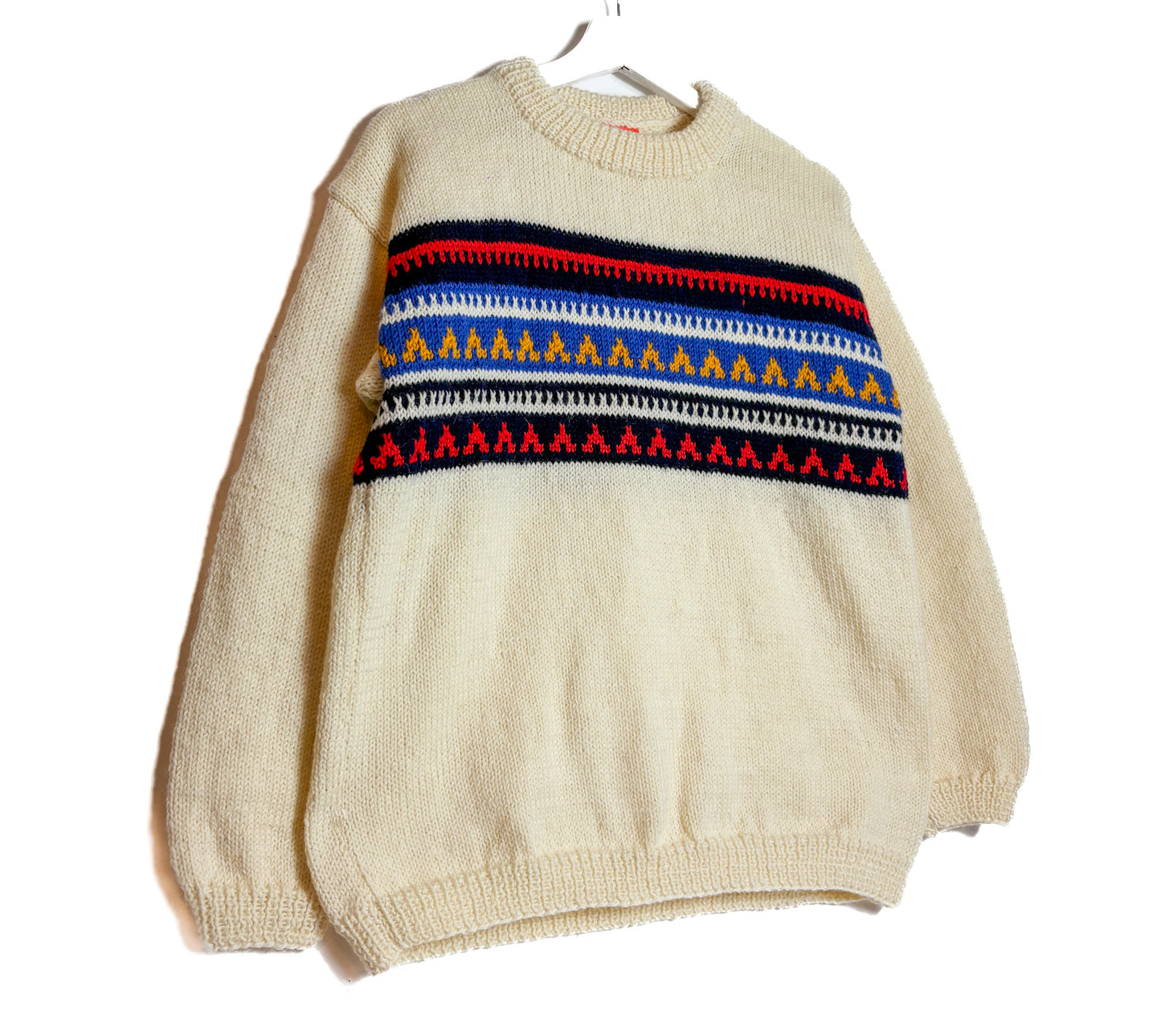 Beige sweater with colorful pattern on a white background