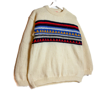 Beige sweater with colorful pattern on a white background