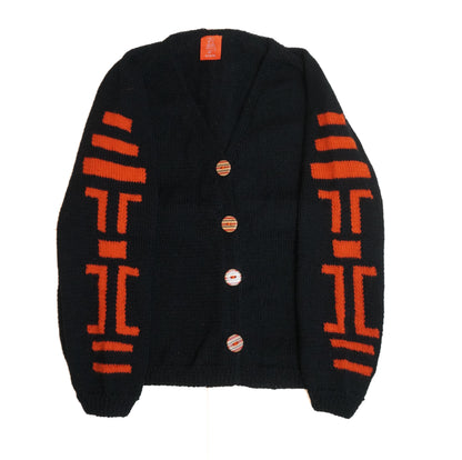Black cardigan with orange patterns on a white background