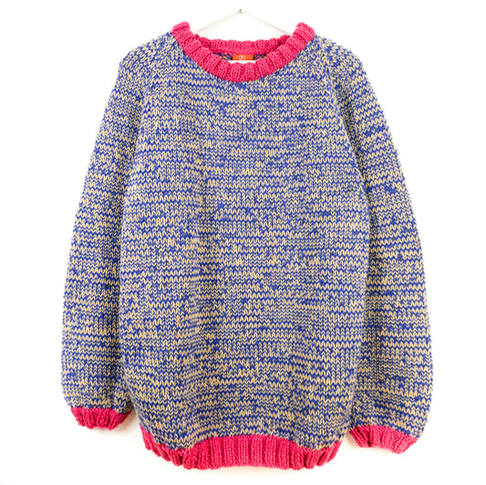 Knitted sweater with blue and yellow pattern and pink trim on a white background