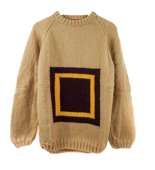 Beige sweater with a black square and yellow border on a white background