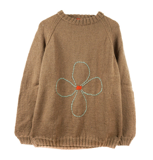 Brown knitted sweater with a flower design on a white background