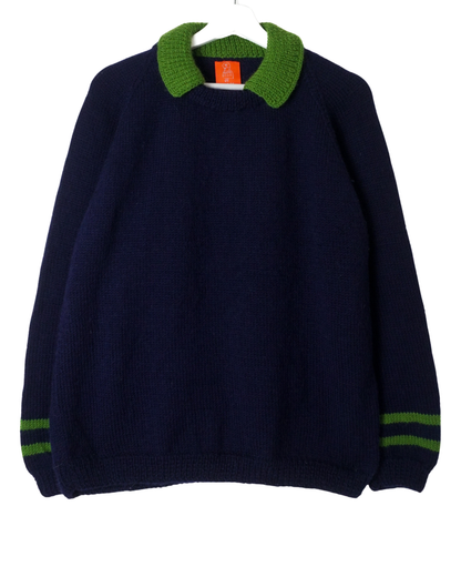 Navy blue sweater with green collar and cuffs on a white background