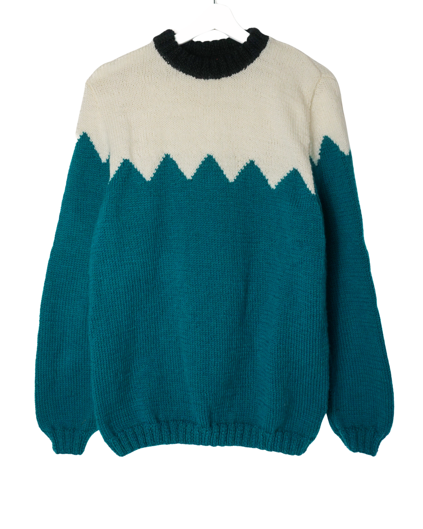 Teal and white sweater with a black collar on a white background