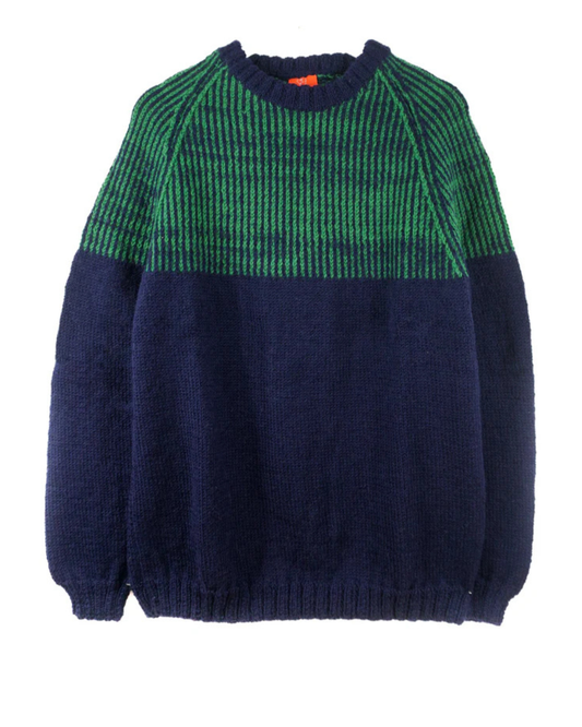 Green and navy jumper on a white background
