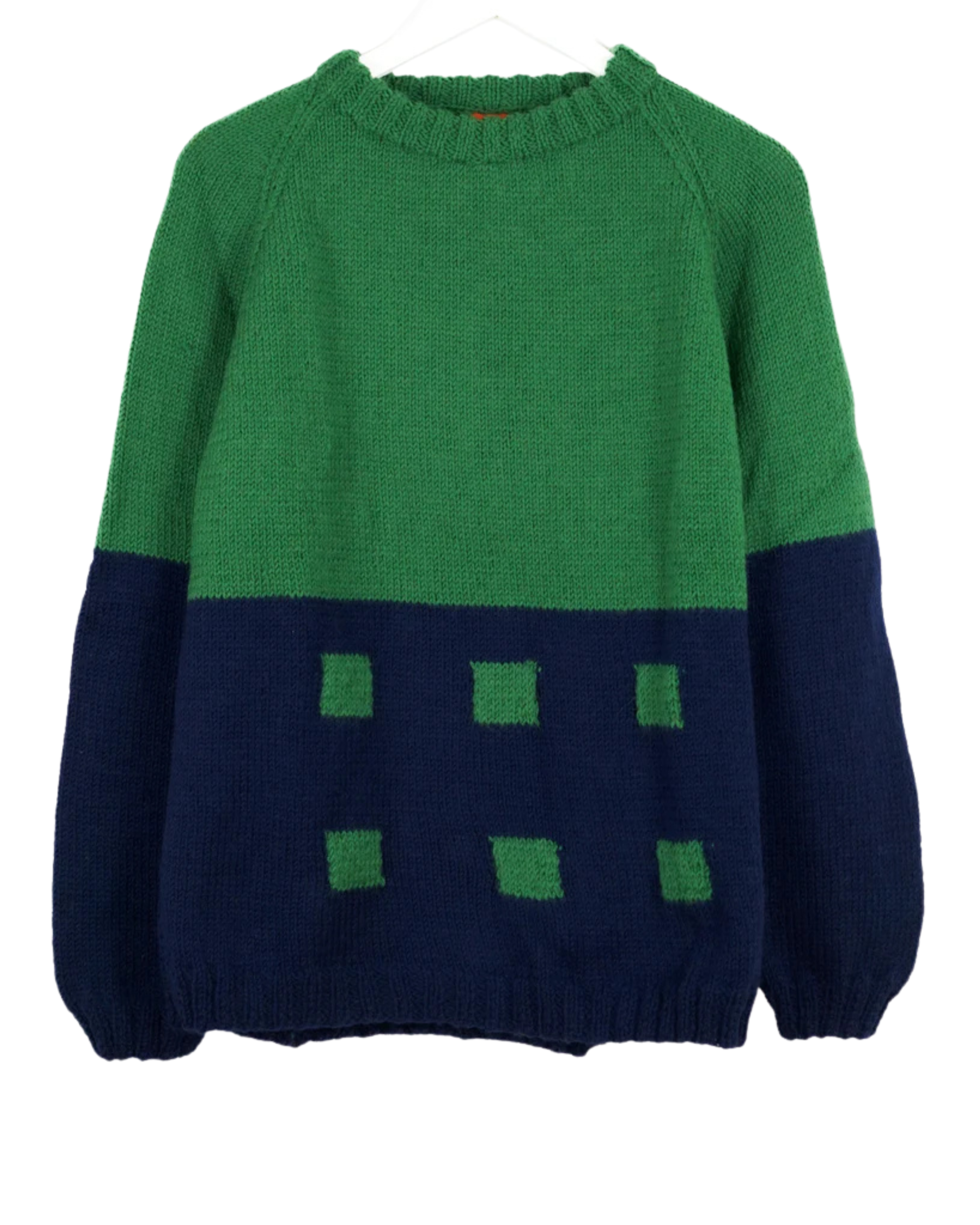 Green and navy sweater with square pattern on a white background