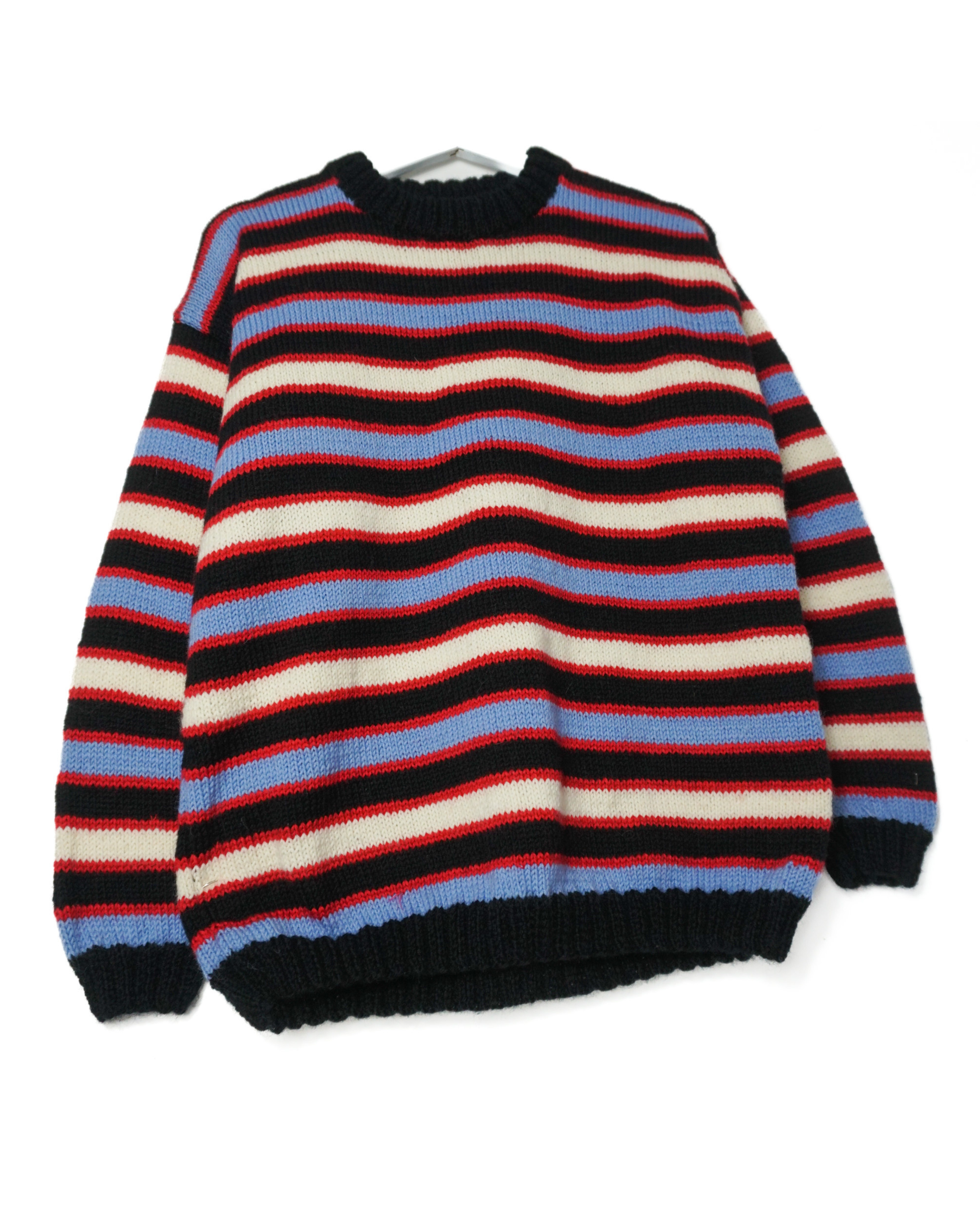 Multicolored striped sweater on a white background