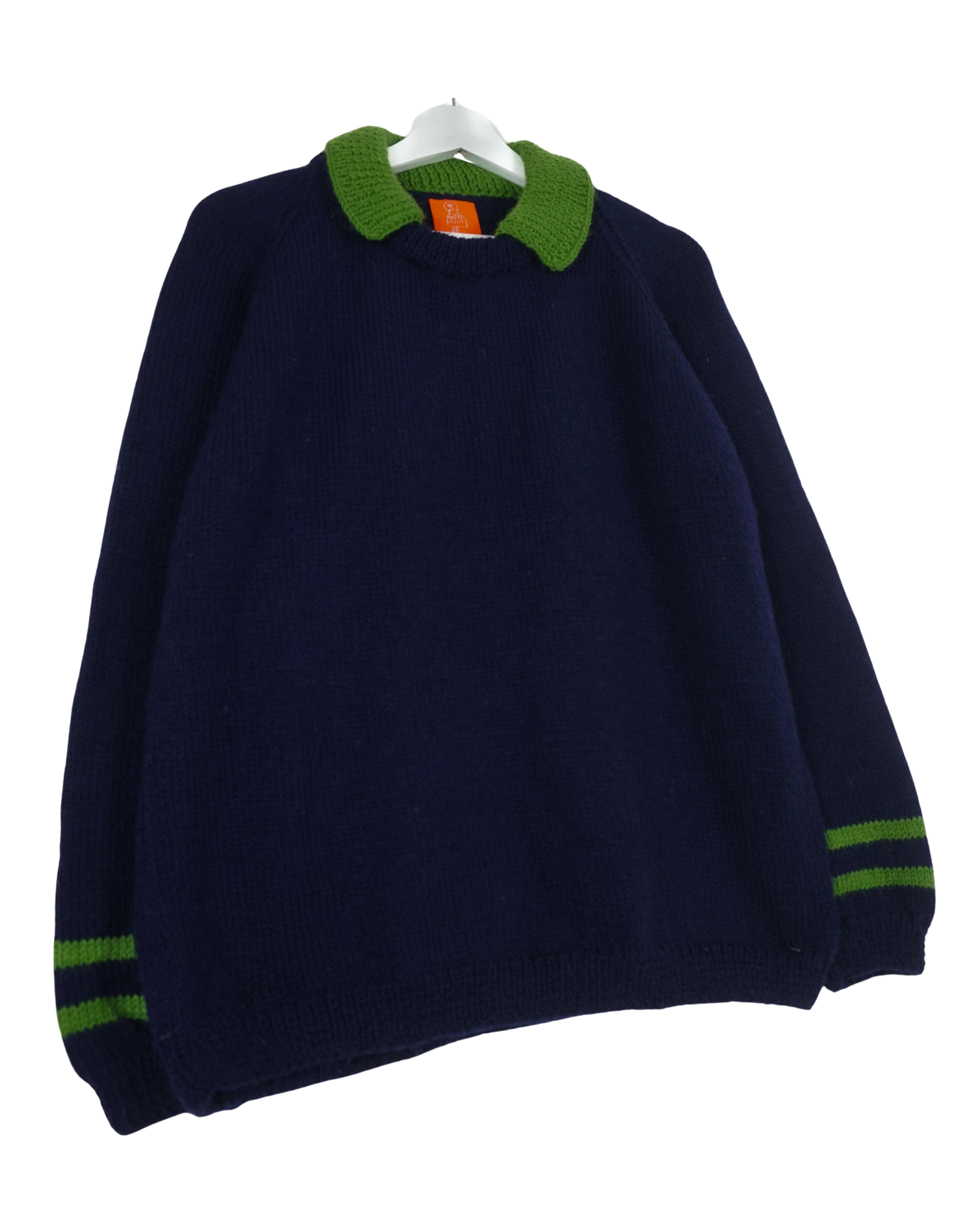 Navy blue sweater with green accents on a white background