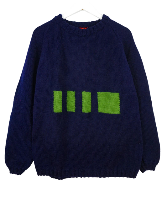 Navy blue sweater with green geometric pattern on a white background