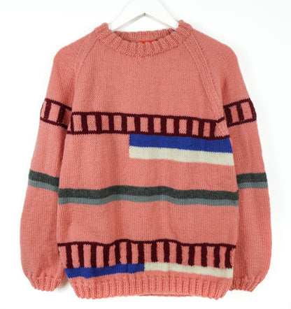 Pink sweater with colorful horizontal stripes on a white background
