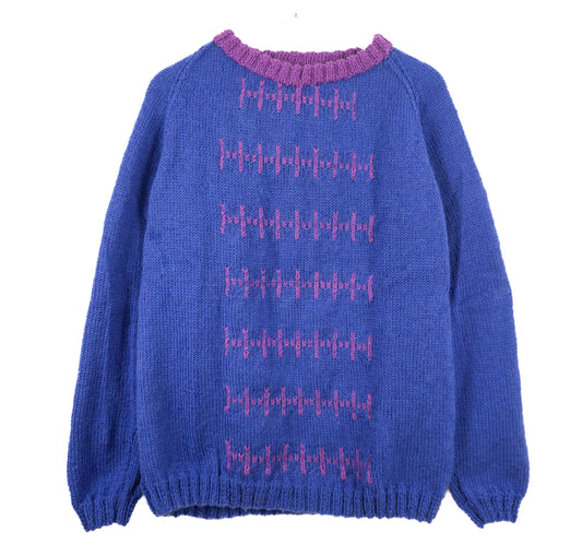 Blue sweater with pink pattern on a white background
