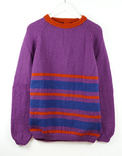 Purple sweater with blue and orange stripes on a white background