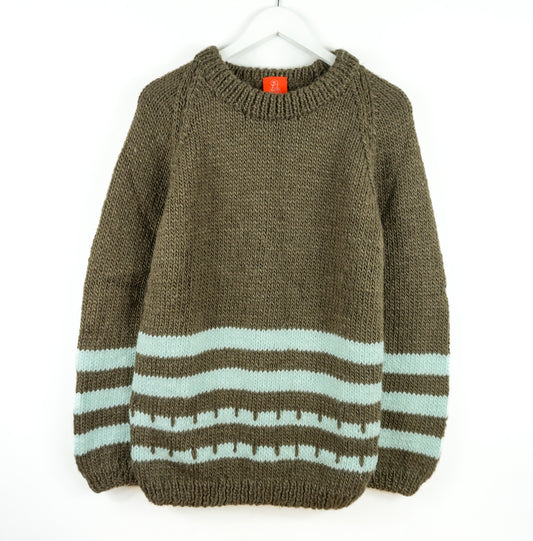 Turqouise patterns brown heavy jumper on a white back ground