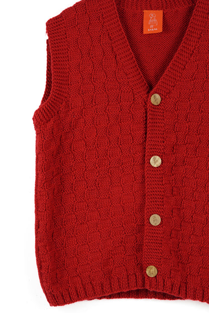 Red sleeveless cardigan with yellow buttons on a white background
