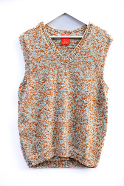 A sleeveless knit sweater vest with a V-neck, featuring a marled pattern of orange and light gray, hanging on a white hanger against a white background.
