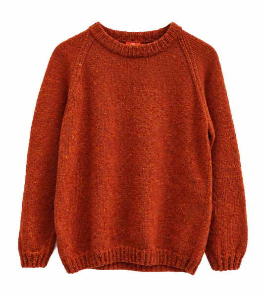 A rust-orange knit crewneck sweater with raglan sleeves, shown flat against a solid white background.