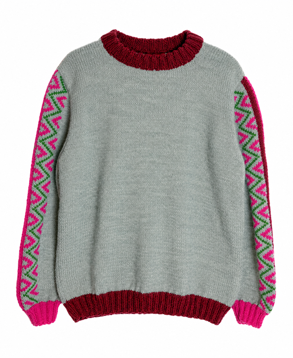 A light gray knit sweater with a dark red crew neck, hem, and cuffs, featuring bright pink and green geometric patterned knit sleeve panels.