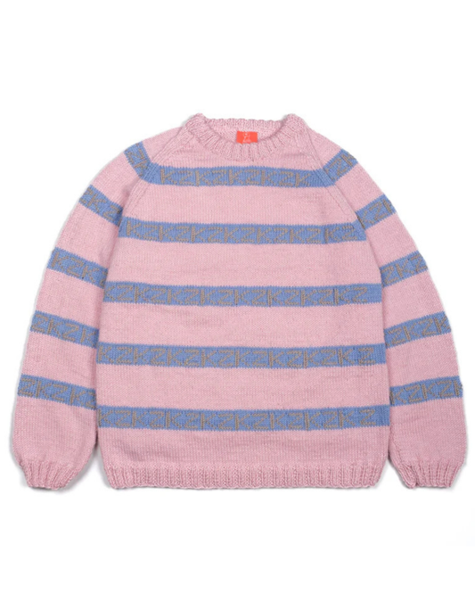 Pink and blue striped sweater on a white background