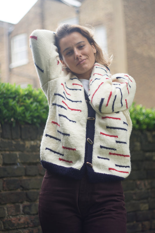 Navy Red Lined Cardigan, one-off hand-knitted cardigan by Kazak Woolies, worn by a model