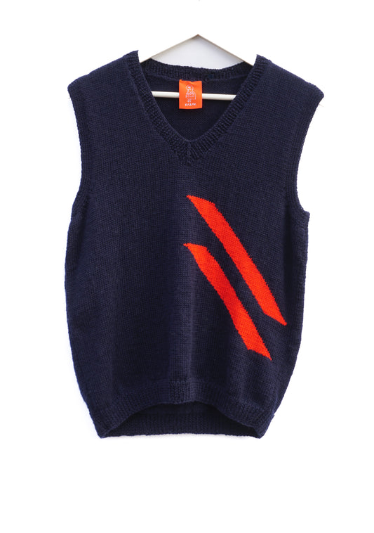 A navy blue knit sweater vest with a V-neck and a bold orange diagonal stripe pattern on the front, hanging on a white hanger against a white background.