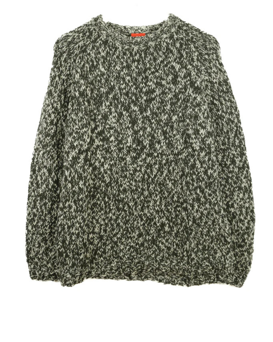 Green and beige patterned jumper on a white background