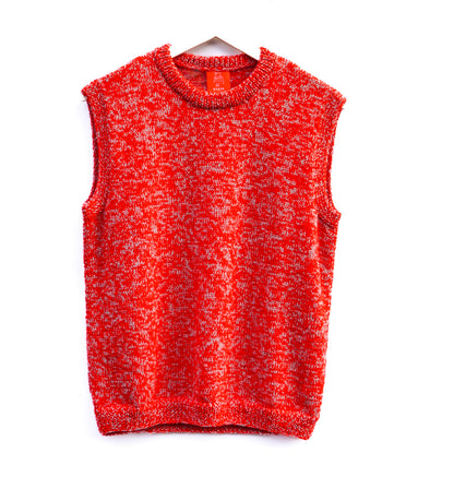 A sleeveless knit sweater vest in a heathered red and white marled pattern, hanging on a black hanger against a plain white background.