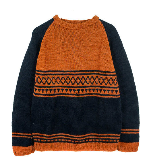 Black and orange sweater with patterned design on a white background